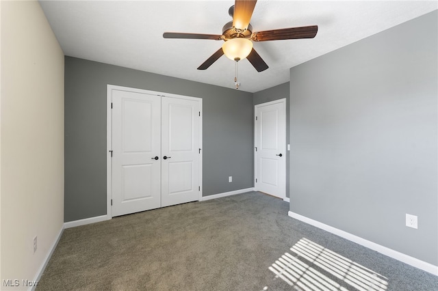 unfurnished bedroom featuring a closet, carpet floors, and ceiling fan