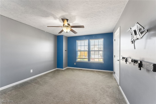 unfurnished room with light carpet, a textured ceiling, and ceiling fan