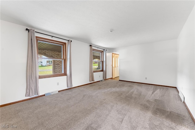 spare room with carpet floors