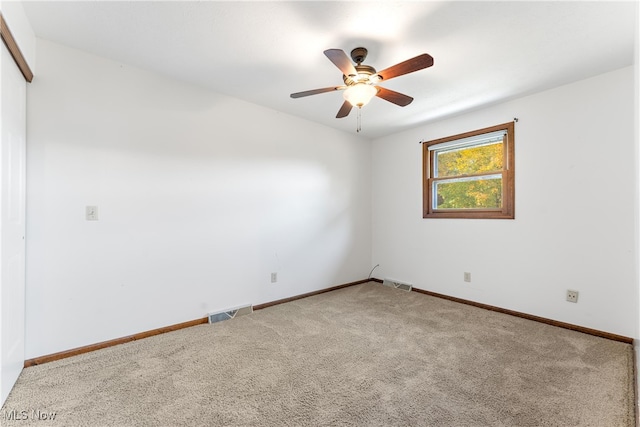 carpeted empty room with ceiling fan