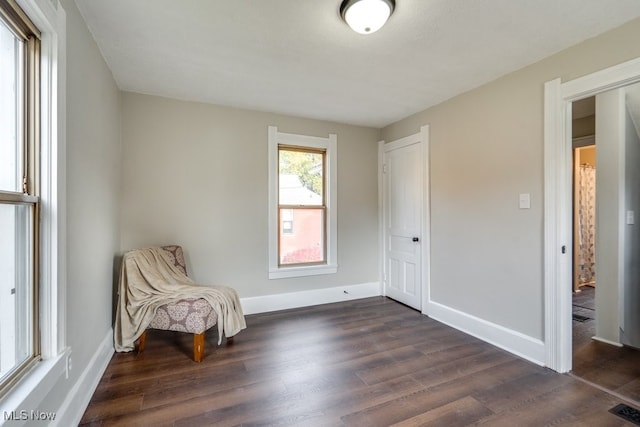 unfurnished room featuring dark hardwood / wood-style flooring