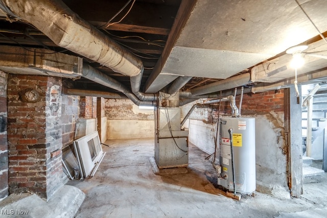 basement featuring water heater and heating unit