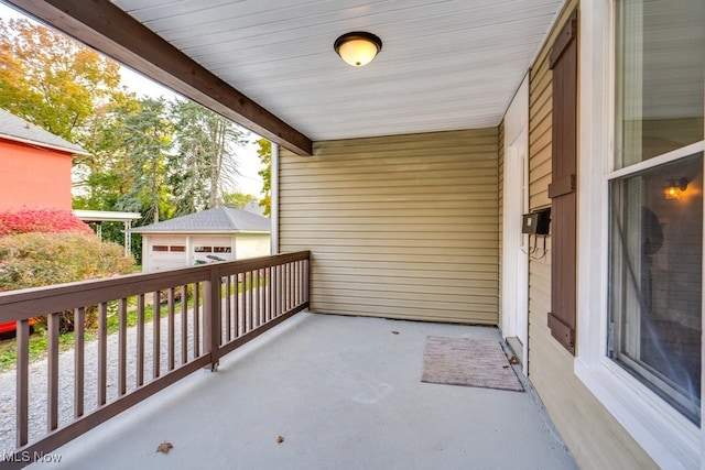 view of patio with an outdoor structure and a garage