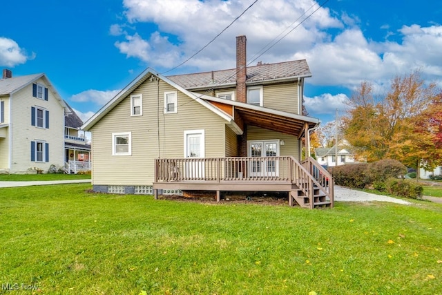 back of house with a yard