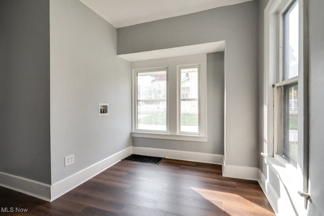 spare room featuring dark hardwood / wood-style flooring