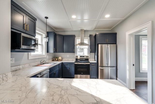 kitchen featuring sink, stainless steel appliances, hanging light fixtures, and plenty of natural light