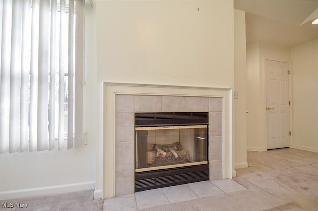 interior details with a fireplace and carpet