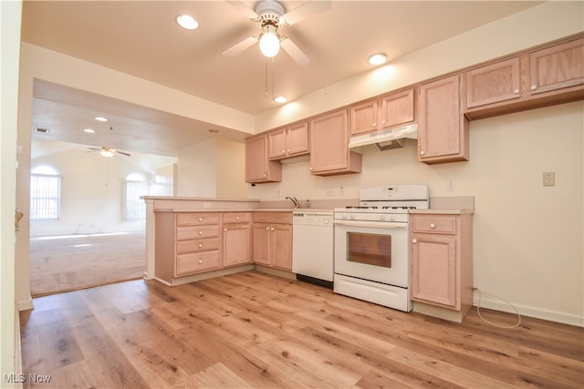 kitchen with white appliances, light hardwood / wood-style floors, light brown cabinetry, and sink