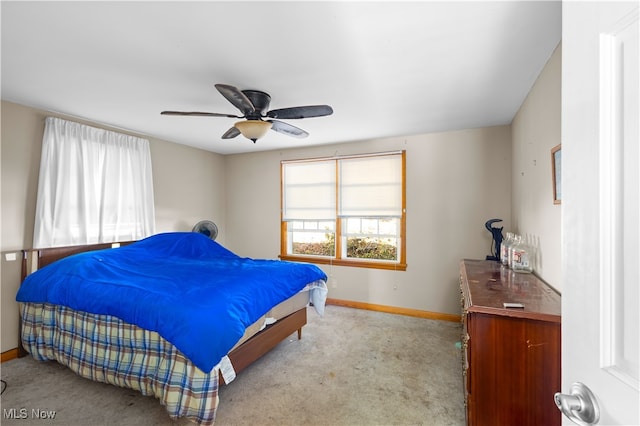 bedroom featuring ceiling fan and light carpet