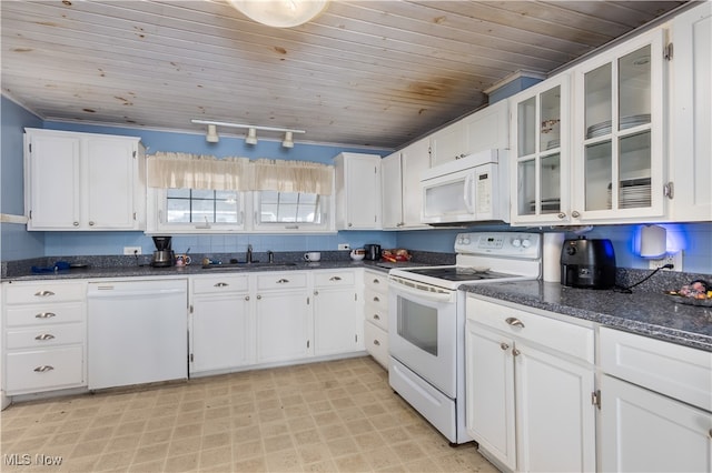 kitchen featuring white cabinets and white appliances