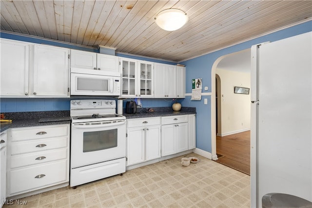 kitchen with decorative backsplash, wood ceiling, white cabinets, and white appliances