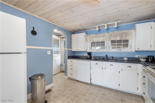 kitchen featuring white appliances, sink, wood ceiling, white cabinetry, and rail lighting