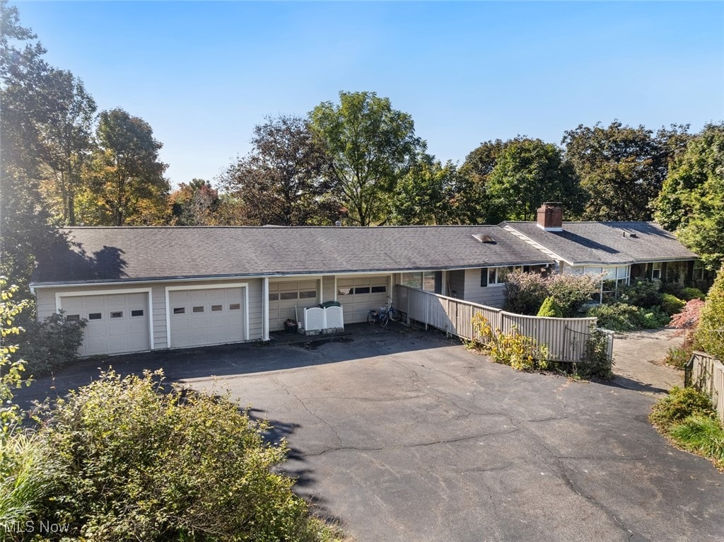 ranch-style house featuring a garage