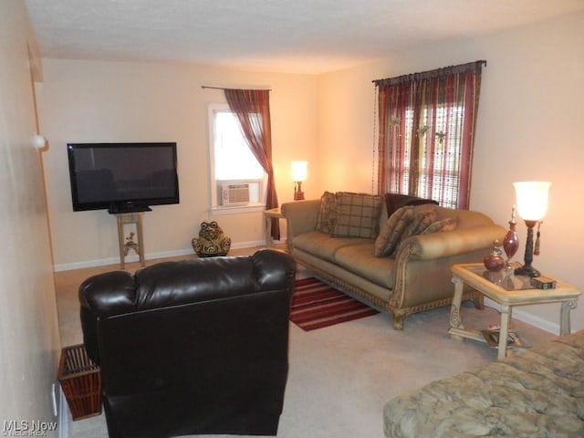 living room with a healthy amount of sunlight, carpet flooring, and cooling unit