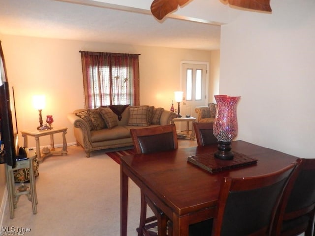 dining space featuring carpet flooring