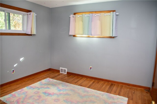 spare room featuring light hardwood / wood-style floors