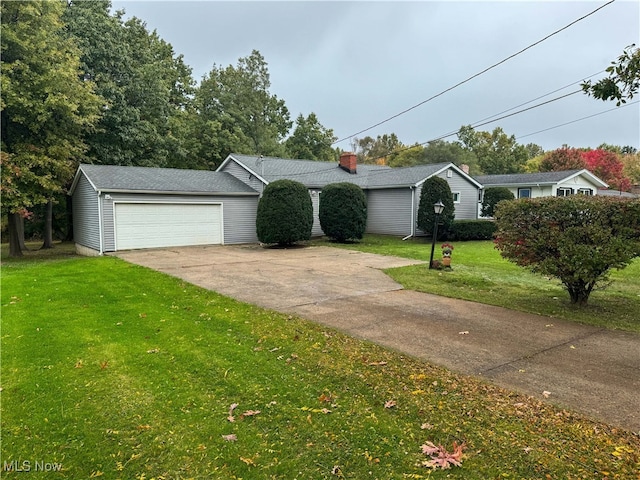 single story home featuring a front lawn and a garage