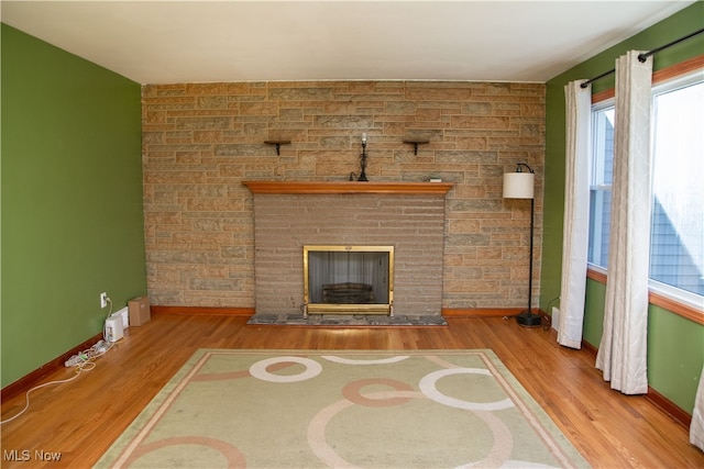 unfurnished living room featuring hardwood / wood-style floors