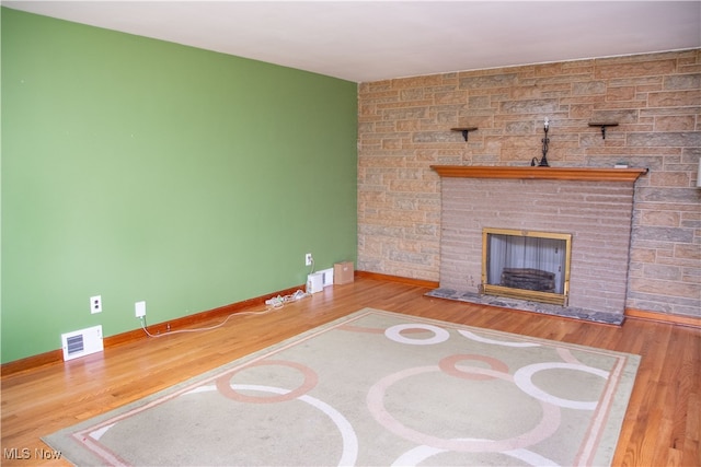 unfurnished living room with wood-type flooring