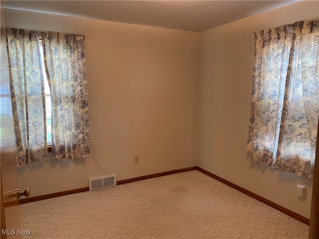 view of carpeted spare room