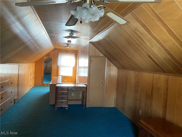 additional living space featuring carpet flooring, vaulted ceiling, and wooden walls