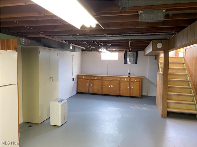 421 W Omar St, Struthers, OH 44471 - below grade area featuring freestanding refrigerator, electric panel, and stairs