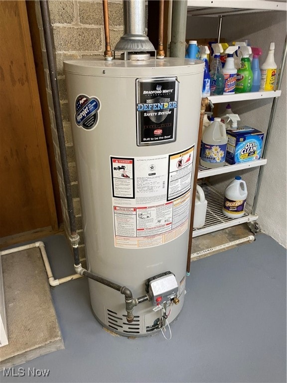 utility room featuring water heater