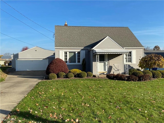421 W Omar St, Struthers, OH 44471 - view of front of home with a chimney, an outdoor structure, a garage, a shingled roof, and a front yard