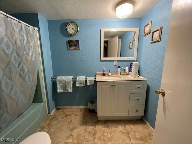 full bathroom featuring vanity, shower / bath combo, a textured ceiling, and toilet