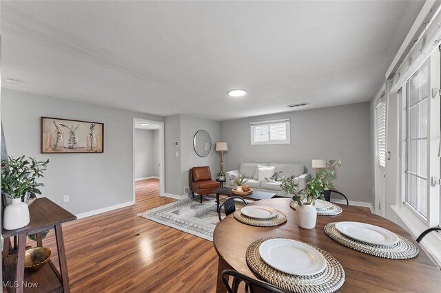 dining room with hardwood / wood-style flooring