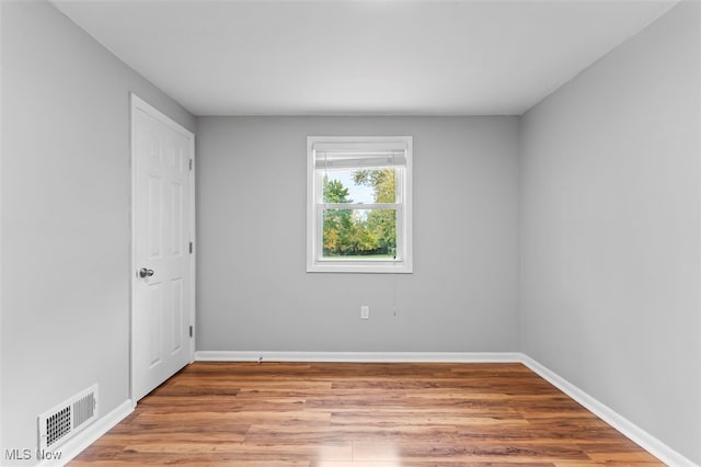 unfurnished room featuring light hardwood / wood-style flooring