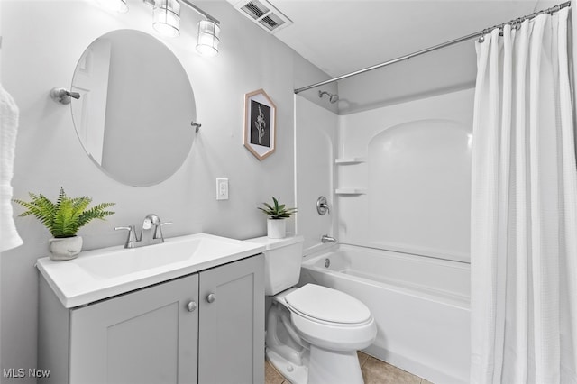 full bathroom featuring tile patterned floors, vanity, shower / bath combination with curtain, and toilet