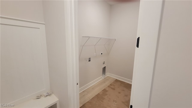 laundry room featuring hookup for a washing machine, light hardwood / wood-style flooring, and hookup for an electric dryer