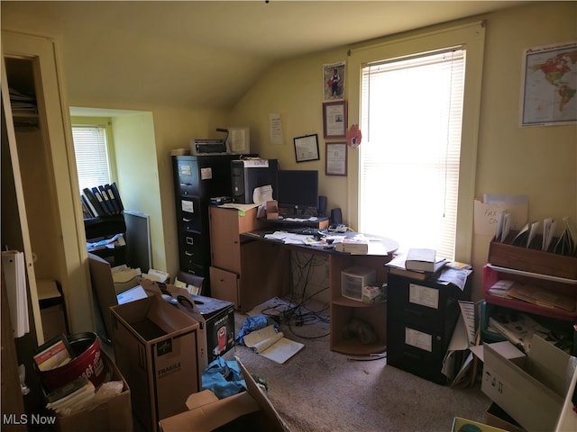 home office with lofted ceiling and carpet