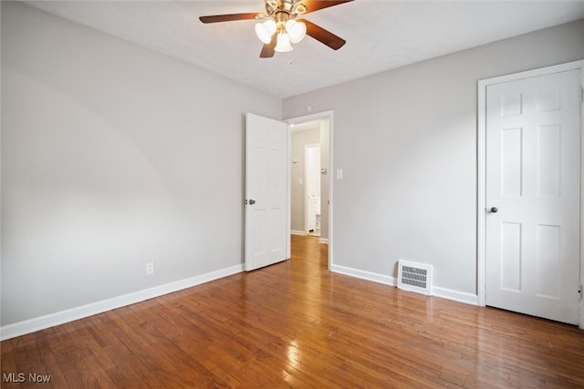 unfurnished bedroom with hardwood / wood-style flooring and ceiling fan