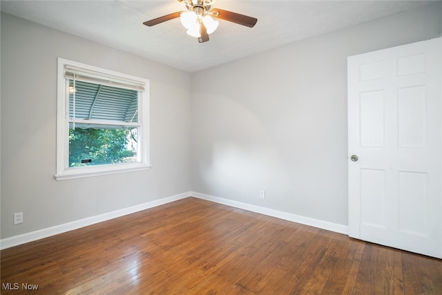 unfurnished room with ceiling fan and hardwood / wood-style floors