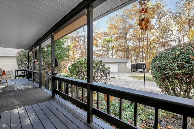 wooden terrace featuring an outdoor structure