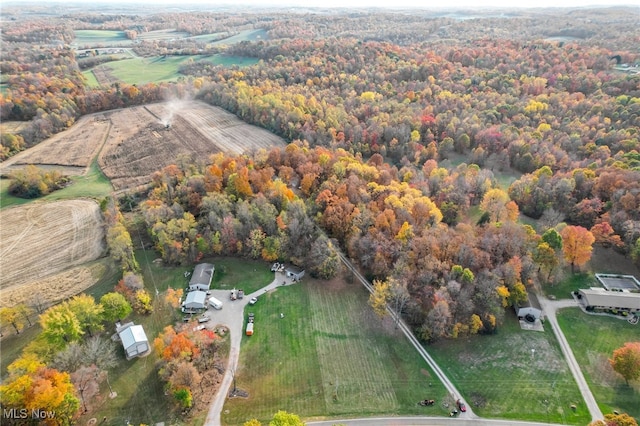 birds eye view of property with a rural view