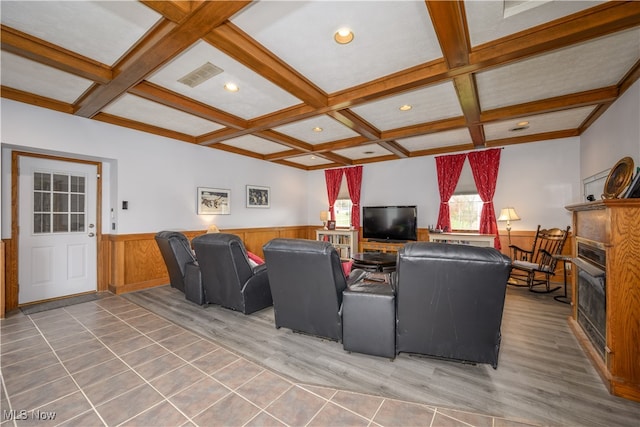 living room with coffered ceiling, beam ceiling, and hardwood / wood-style flooring