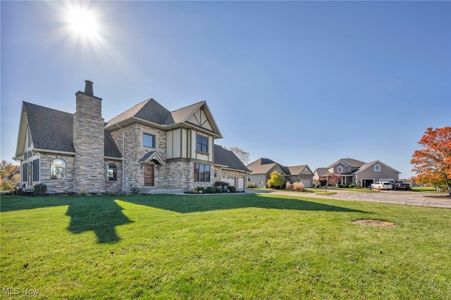 exterior space featuring a garage and a lawn