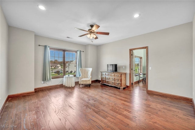 unfurnished room featuring ceiling fan and wood-type flooring