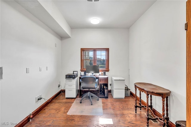 office area featuring dark wood-type flooring