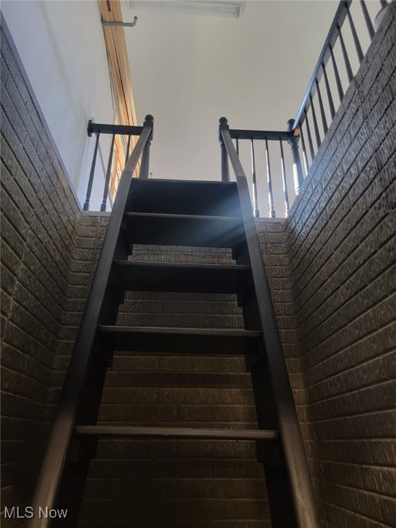 staircase with a high ceiling