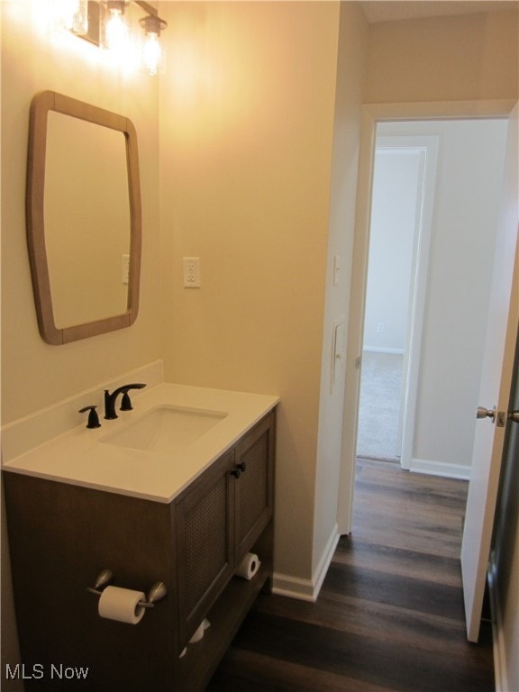 bathroom with vanity and wood-type flooring