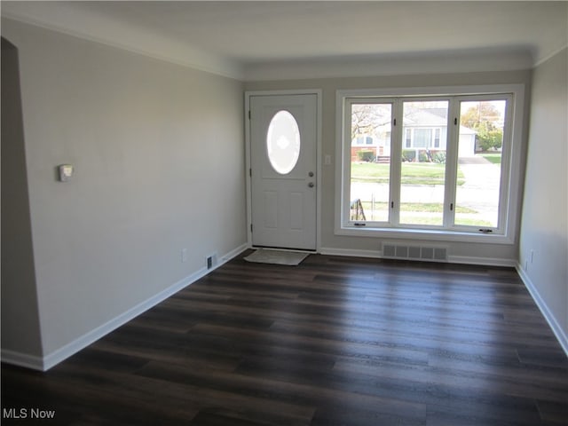 entryway featuring dark hardwood / wood-style floors and crown molding