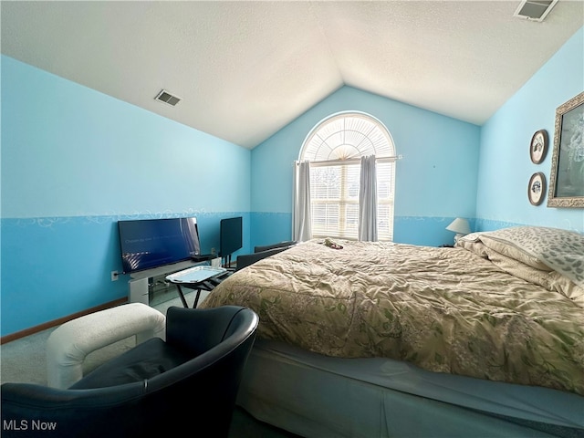 bedroom with lofted ceiling