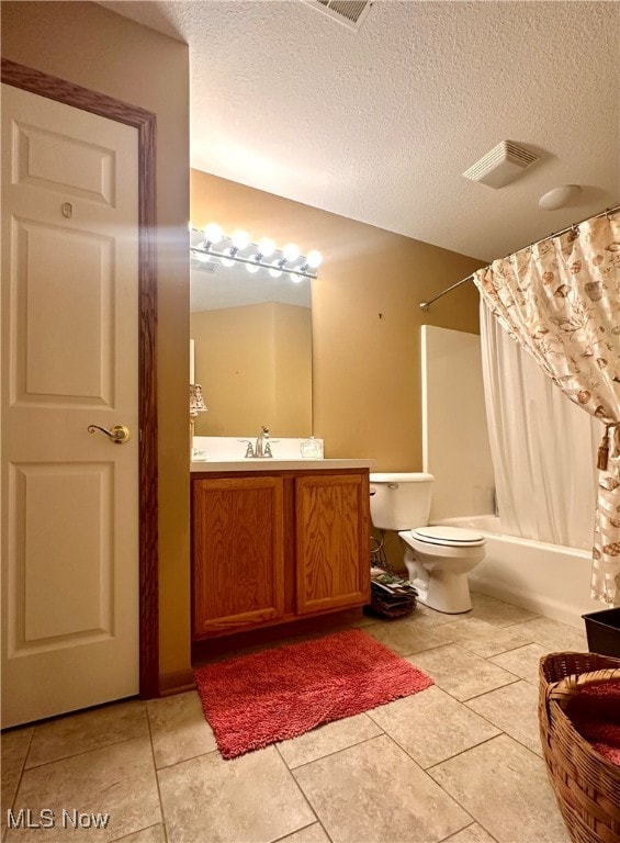 full bathroom featuring vanity, toilet, a textured ceiling, and shower / bath combo