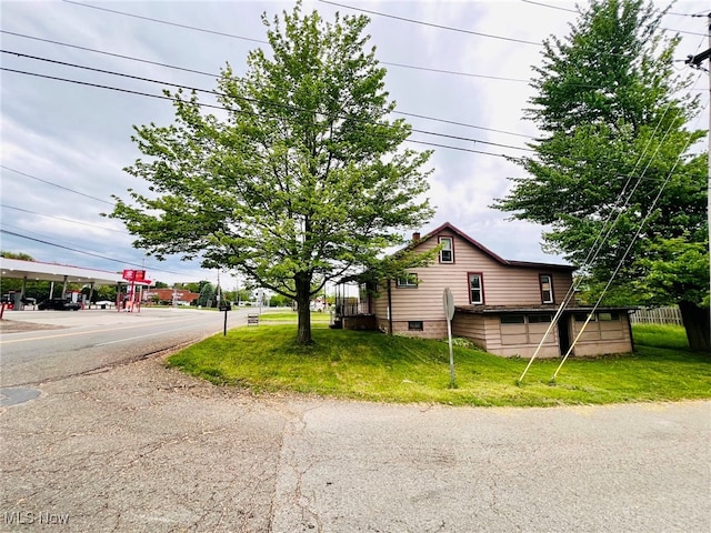 view of property exterior featuring a yard