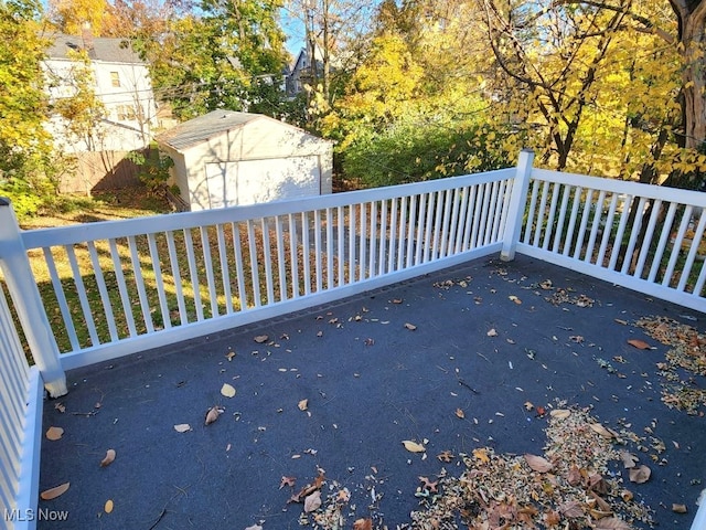 view of patio featuring a storage shed