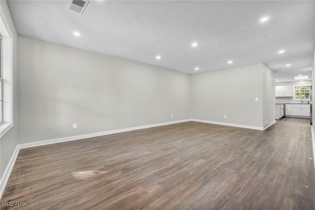 spare room with dark hardwood / wood-style floors